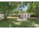 A spacious backyard featuring a patio and view of the house at 613 Poplar Dr, Shelby, NC 28152