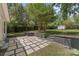 A spacious backyard featuring a brick patio, mature trees and room for outdoor activities at 613 Poplar Dr, Shelby, NC 28152