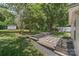 A spacious backyard featuring a brick patio, mature trees and room for outdoor activities at 613 Poplar Dr, Shelby, NC 28152
