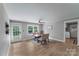 Bright dining area with wood-look flooring, ceiling fan, back door and room to entertain at 613 Poplar Dr, Shelby, NC 28152