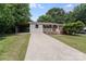 Charming home with a well-manicured lawn and a long driveway at 613 Poplar Dr, Shelby, NC 28152