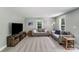 Cozy living room featuring plush carpeting, two neutral sofas, decorative pillows and plenty of natural light at 613 Poplar Dr, Shelby, NC 28152