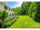 Lush backyard with manicured lawn and deck, great for outdoor entertaining at 701 Larkridge Ct, Rock Hill, SC 29730