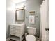 Well-lit bathroom with a single vanity, framed mirror, and shower with a white shower curtain at 701 Larkridge Ct, Rock Hill, SC 29730