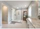 Bathroom with a glass shower, sleek marble counters, and warm accent shelves at 701 Larkridge Ct, Rock Hill, SC 29730