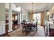 Elegant dining room with hardwood floors, natural light, and decorative chandelier at 701 Larkridge Ct, Rock Hill, SC 29730