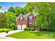Charming brick home with two-car garage, lush lawn, and mature trees in a desirable neighborhood at 701 Larkridge Ct, Rock Hill, SC 29730