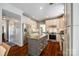 Modern kitchen with granite countertops, stainless steel appliances, and a kitchen island at 701 Larkridge Ct, Rock Hill, SC 29730