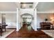 Open-concept living space with hardwood floors, arched doorways, and abundant natural light at 701 Larkridge Ct, Rock Hill, SC 29730