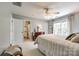 Spacious main bedroom with an ensuite bathroom, dresser, ceiling fan, and natural light at 701 Larkridge Ct, Rock Hill, SC 29730