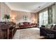 Sitting room featuring hardwood floors, decorative wallpaper, and large windows at 701 Larkridge Ct, Rock Hill, SC 29730