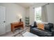 Spare bedroom featuring comfortable seating and a writing desk near a large window at 711 Beaty St, Davidson, NC 28036