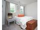 Comfortable bedroom features two large windows, neutral paint, and well-chosen furniture at 711 Beaty St, Davidson, NC 28036