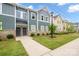 Charming townhome with manicured lawn and inviting front entrances at 711 Beaty St, Davidson, NC 28036