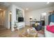 Cozy living room with hardwood floors, bright natural lighting, and a comfortable ambiance at 711 Beaty St, Davidson, NC 28036