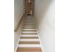 Ascending staircase with modern wood-and-white design and plenty of light at 711 Beaty St, Davidson, NC 28036