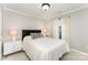 Comfortable bedroom featuring a neutral palette, plush bedding, and modern nightstands at 7211 Baniff Cir, Charlotte, NC 28277