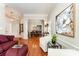 Open-concept living room and dining area with hardwood floors and stylish decor at 7211 Baniff Cir, Charlotte, NC 28277