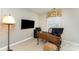 Functional home office with a large desk, ample storage, and a bright window for natural light at 7211 Baniff Cir, Charlotte, NC 28277
