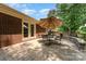 Outdoor patio with seating area and view of the brick house at 7211 Baniff Cir, Charlotte, NC 28277