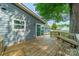 Large backyard with new siding and window and a wooden patio at 7901 Reames Rd, Charlotte, NC 28216
