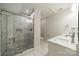 Newly remodeled bathroom featuring a glass enclosed shower, double sinks, and updated fixtures at 7901 Reames Rd, Charlotte, NC 28216
