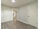 Cozy bedroom with fresh paint and new floors featuring ample space, and lots of natural light at 7901 Reames Rd, Charlotte, NC 28216