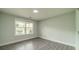 Comfortable bedroom with neutral walls, lots of light, and a view of the backyard at 7901 Reames Rd, Charlotte, NC 28216