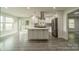 Bright, open kitchen features a large island, stainless steel appliances, and ample counter space at 7901 Reames Rd, Charlotte, NC 28216