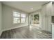 Eat-in kitchen area with access to a deck through sliding glass doors and a sunny view at 7901 Reames Rd, Charlotte, NC 28216