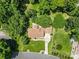 Aerial view of a home with a large yard and mature trees at 7916 Wellston Dr, Charlotte, NC 28210