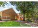 Beautiful backyard with a large tree providing shade and a patio area at 7916 Wellston Dr, Charlotte, NC 28210