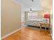 Bright bedroom featuring hardwood floors, a sloped ceiling, and a cozy bed at 7916 Wellston Dr, Charlotte, NC 28210
