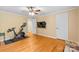 Spacious bedroom featuring hardwood floors and a mounted television at 7916 Wellston Dr, Charlotte, NC 28210