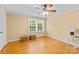 A cozy bedroom with ample natural light and a ceiling fan at 7916 Wellston Dr, Charlotte, NC 28210