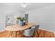 Bright dining room featuring hardwood floors and a stylish table with gray chairs at 7916 Wellston Dr, Charlotte, NC 28210