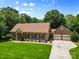 Beautiful brick home featuring a well-manicured lawn, a driveway, and an attached two-car garage at 7916 Wellston Dr, Charlotte, NC 28210