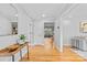 Inviting hallway with hardwood floors, neutral walls, and decorative accents at 7916 Wellston Dr, Charlotte, NC 28210