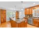 Spacious kitchen with stainless steel appliances, a center island, and lots of storage at 7916 Wellston Dr, Charlotte, NC 28210