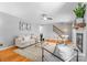 Cozy living room with hardwood floors, comfortable seating, and a modern fireplace at 7916 Wellston Dr, Charlotte, NC 28210