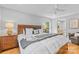 Comfortable main bedroom featuring a ceiling fan and en suite bathroom at 7916 Wellston Dr, Charlotte, NC 28210