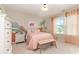 Charming bedroom with colorful dinosaur themed decor, a bench seat and natural light at 7930 Rolling Wheels Rd, Charlotte, NC 28215
