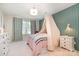 Cozy bedroom with stylish decor, soft lighting, and a window view at 7930 Rolling Wheels Rd, Charlotte, NC 28215