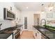 Well-equipped kitchen with modern appliances, white cabinets, sleek countertops, and stylish lighting at 7930 Rolling Wheels Rd, Charlotte, NC 28215