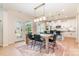 Bright, modern kitchen with white cabinets, granite countertops, and a large dining area at 7930 Rolling Wheels Rd, Charlotte, NC 28215