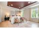 Luxurious main bedroom with tray ceiling, hardwood floors, and natural light at 7930 Rolling Wheels Rd, Charlotte, NC 28215