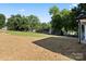 Large backyard featuring green grass and an in-ground lawn irrigation system at 8632 Cedarbrook Dr, Charlotte, NC 28215