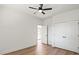 Minimalist bedroom with a ceiling fan, light-colored flooring, and a closet at 8632 Cedarbrook Dr, Charlotte, NC 28215