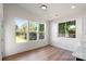 Living room with hardwood floors, bright windows, and natural light, perfect for entertaining at 8632 Cedarbrook Dr, Charlotte, NC 28215