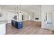 Open concept living space featuring a modern kitchen, fireplace, and lots of natural light at 8632 Cedarbrook Dr, Charlotte, NC 28215